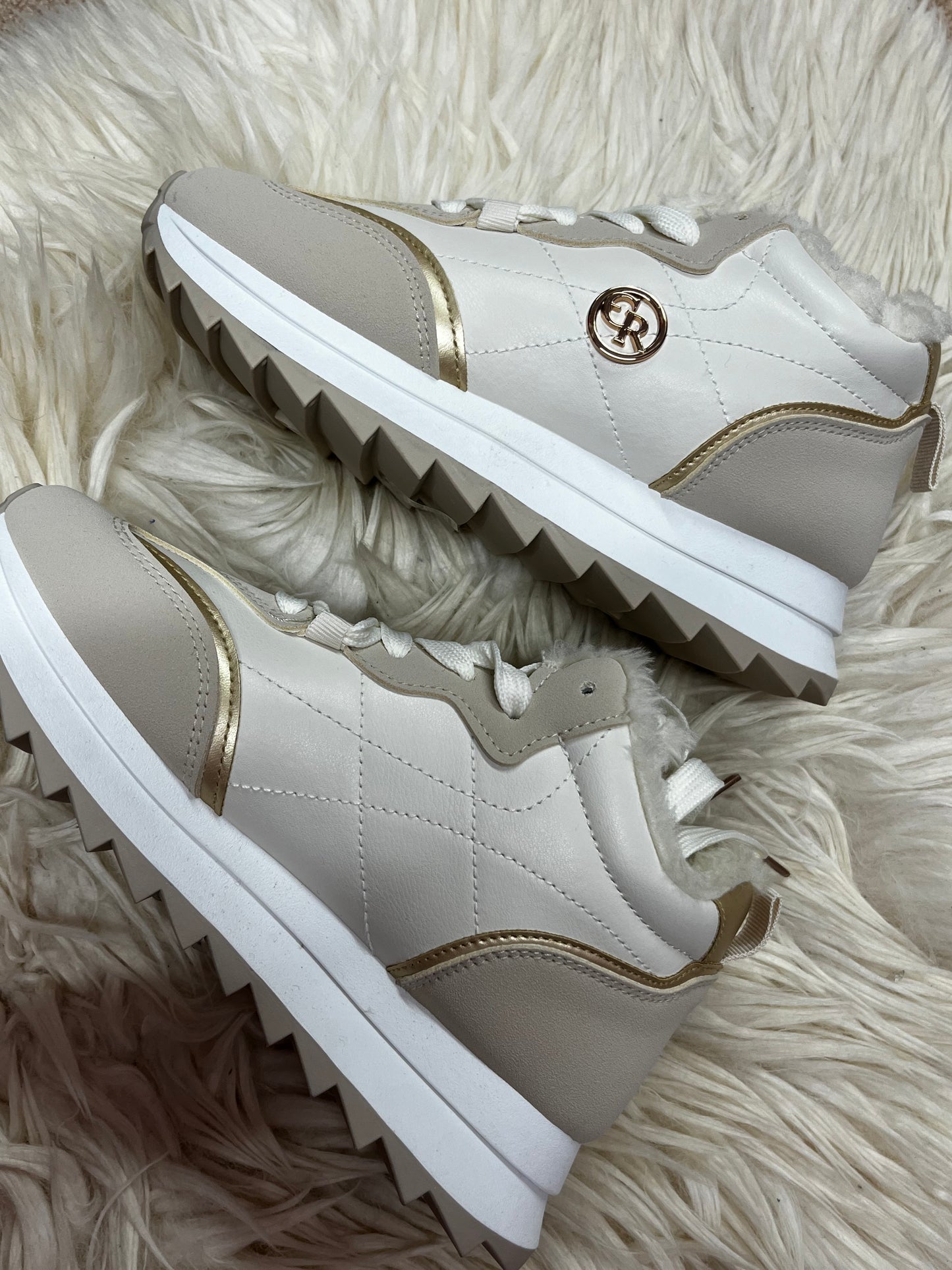 White and beige fleeced lined trainers