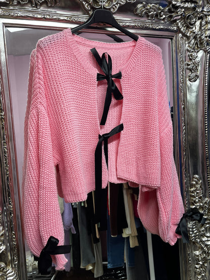 Knitted cardigans with ribbon bows