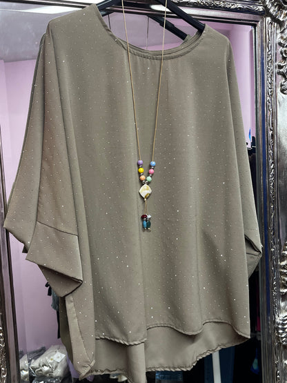 Plus size sparkly top with beaded necklace